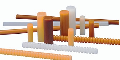 Image of a collection of various sizes and shapes of 3M™ Hot Melt adhesive sticks
