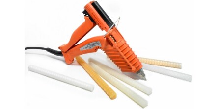 Image of an applicator gun and various hot melt sticks
