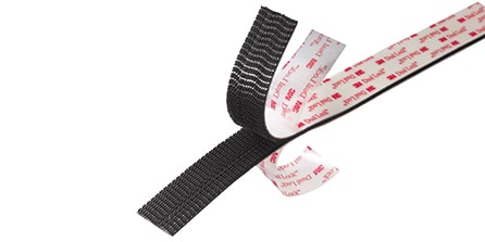 Image of a partly separated strip of 3M™ Dual Lock™ Reclosable Fastener with the protective liners partly peeled back
