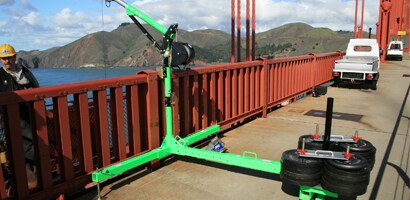 Vertical davit installed at railing of suspension bridge
