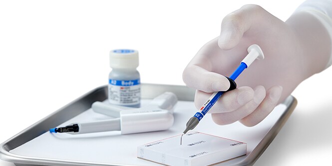hand holding syringe
